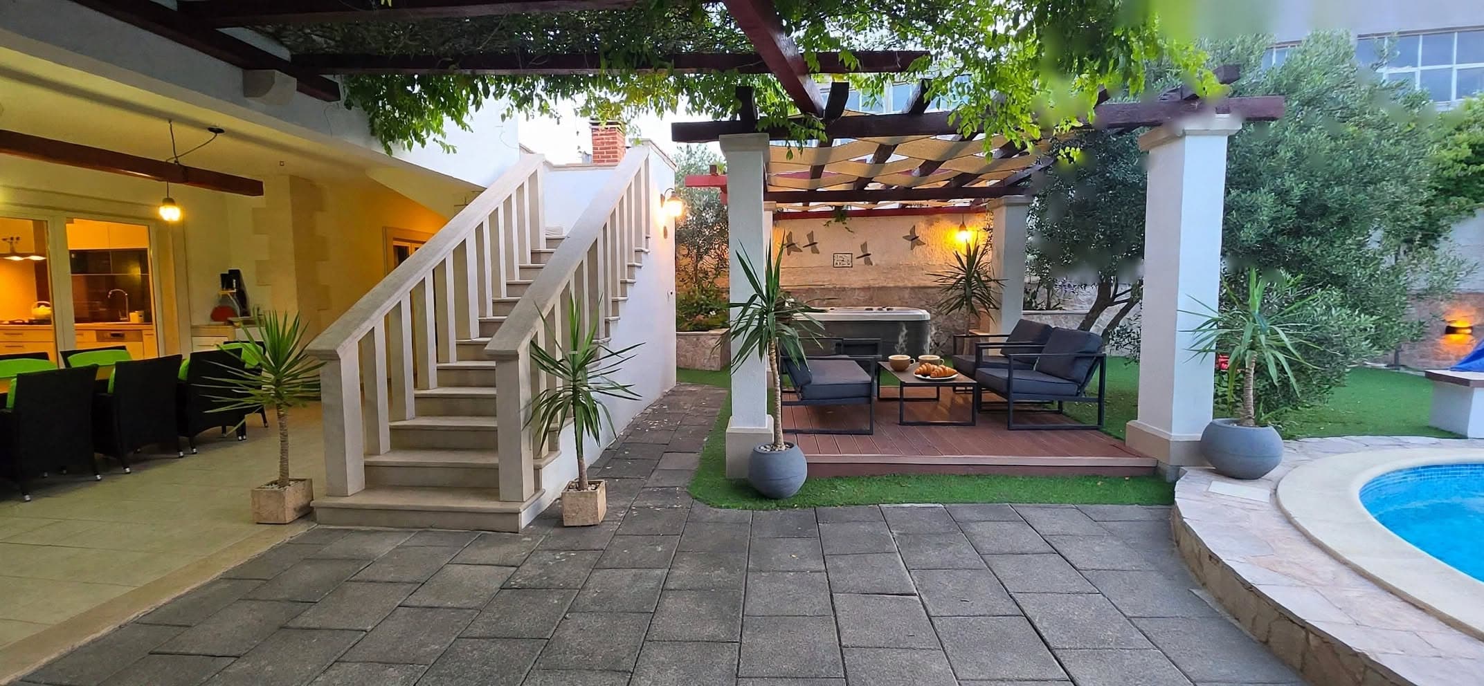 Covered terrace with stairs to the upper floor